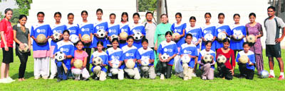 Participating girls, and the coaching staff, at the soccer camp at YFC Rurka Kalan