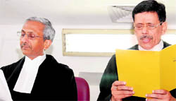 Justice VS Malik (R) being administered oath by Acting Chief Justice Adarsh Kumar Goel in Chandigarh on Wednesday