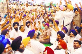 Activists of SAD-BJP stage a protest in Amritsar on Thursday. 