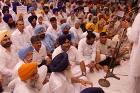 Deputy Chief Minister Sukhbir Singh Badal (above) takes part in a dharna staged by the SAD-BJP near the Mini-secretariat in Bathinda on Thursday; Irrigation Minister Janmeja Singh Sekhon and MP Sher Singh Ghubaya submitting a memorandum to Ferozepur Deputy Commissioner.