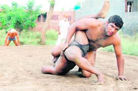 Wrestlers practicing in an akhara in Tarn Taran near Amritsar. 