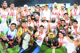 Haryana team players celebrate after winning the 1st Hockey India senior National Men�s Championship at Aish Bagh stadium in Bhopal on Sunday
