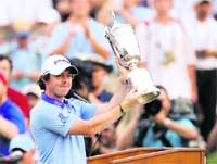 Rory McIlroy holds aloft the US Open Trophy at Congressional Country Club in Maryland on Monday. 