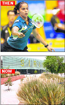 Saina Nehwal in action during the Games; and (below) weeds dot the Siri Fort Complex giving it a dirty look