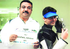 Dr. Amit Bhattacharjee (L) with Abhinav in Germany, an hour before his performance to qualify for the London Olympics.