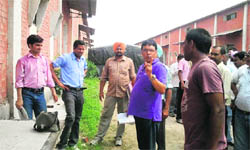 CBI sleuths, along with officials of the FCI, inspect a storage depot at Rampura (Bathinda) on Friday. 