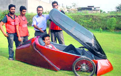 Cost: Rs 2 lakh. Three wheels, 35 cc engine, Fibre body,Weight: 55 kg