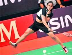 Saina Nehwal hits a return to Wang Yihan during the final of the Indonesia Open badminton tournament in Jakarta on Sunday. Wang won 21-12, 21-23, 14-21