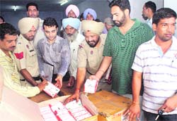 Drug Inspector Jasvir Singh and in charge, CIA, Patiala, Sukhminder Singh show the seized drugs to the mediapersons at Rajpura.