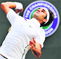 Roger Federer serves to Jo-Wilfried Tsonga in London on Wednesday. 