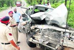 Mangled remains of a car at the Kharar-Kurali road