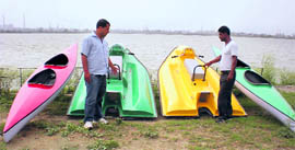 Water scooters, row boats at the lake in Bathinda. 