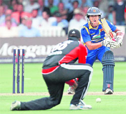 Dinesh Chandimal (R) gestures whilst batting during the third ODI match at Lord's in London on Sunday.