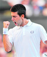 New world number one Novak Djokovic celebrates his success at Wimbledon.