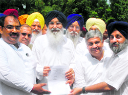 CM Parkash Singh Badal with SAD and BJP leaders at the Raj Bhawan in Chandigarh