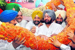 Congress workers greet PPCC chief Capt Amarinder Singh in Mohali on Wednesday