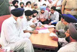 Deputy Chief Minister Sukhbir Badal with SAD leaders at Ajitwal village in Moga 