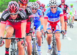 France's Sylvain Chavanel (C) rides in the pack in the 189 km eighth stage of the Tour de France on Saturday