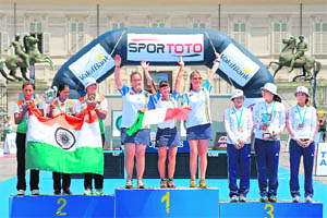 Indian archers (L) celebrate after winning silver at the Archery World Championships Recurve Team event in Turin on Sunday.