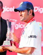 MS Dhoni with the winner�s trophy in Dominica on Sunday.