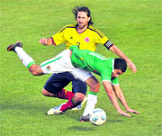 Bolivian forward Alcides Pena (front) vies for the ball with Colombian defender Mario Yepes in Santa Fe, Argentina in Copa America action on Sunday. 