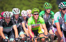 Green jersey Belgium's Philippe Gilbert (C) rides in the pack during the 208 km ninth stage of the 2011 Tour de France on Sunday.