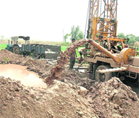 Boring work in progress at a village in Patiala. 