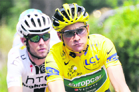 Yellow jersey France's Thomas Voeckler (R) rides during the 158 km tenth stage of the 2011 Tour de France on Tuesday.