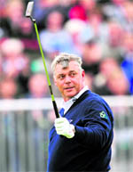 Darren Clarke gestures on the 18th green on the first day of the 140th British Open Golf championship in Sandwich on Thursday.