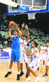 India's center Satnam Singh goes for a lay-up in New Delhi on Friday.