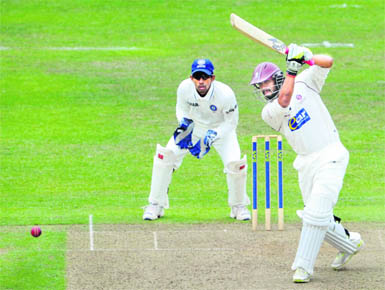 Somerset's Arul Suppiah hits a ball from Amit Mishra during their tour match in Taunton 