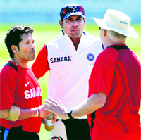Sachin Tendulkar (L) and VVS Laxman (C) speak to coach Duncan Fletcher during a net session in Taunton