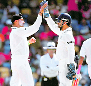 Harbhajan Singh (L) and MS Dhoni