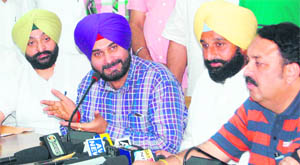 Navjot Sidhu (second from left) addressing the mediapersons in Amritsar on Wednesday. Also in picture is Bikram Singh Majithia (second from right), president Youth Akali Dal, Inderbir Bularia (left) MLA and Shwet Malik, Mayor (right).