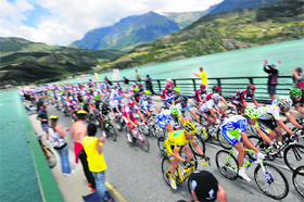 Fans cheer Yellow jersey France's Thomas Voeckler, riding in the pack during the 179 km 17th stage of Tour de France on Wednesday. 