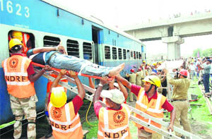 National Disaster Response Force and the Railways staff �rescue passengers� from a bogey during a mock drill in Bathinda.