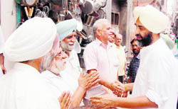 PPP chief Manpreet Badal meets his supporters at a party function in Amritsar on Thursday.