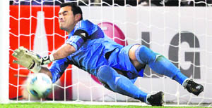 Paraguay's goalkeeper Justo Villar blocks the shot by Venezuela's Franklin Lucena during their penalty shootout in Mendoza 