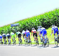 The pack rides in the 200.5 km 18th stage of the Tour de France 