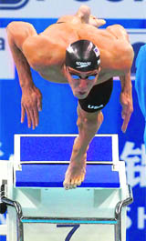 Michael Phelps of the U.S. jumps off the block during the men�s 200m butterfly semifinal at the 14th FINA World Championships in Shanghai 