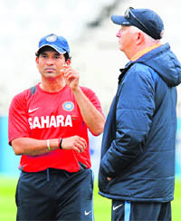 Sachin Tendulkar talks to coach Duncan Fletcher during a practice session at Trent Bridge in Nottingham 