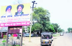 Hoardings put up reportedly by the relatives of DGP PS Gill on the national highway outside the district administrative complex in Moga