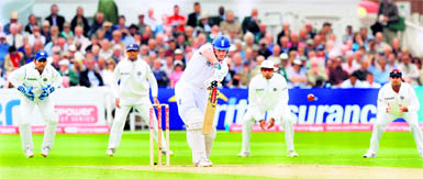 Andrew Strauss (C) watches his shot during the first day of the second Test against India at Trent Bridge in Nottingham on Friday. England are 124 for 8 at Tea. 