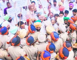 Congress MLA Ripjeet Singh Brar and other party activists being taken into custody at Datewas village