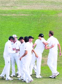 England players celebrate after beating India in the second Test at Trent Bridge on Monday