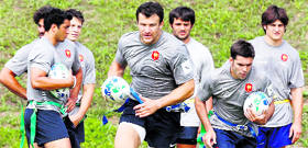 France's national rugby team players Damien Traille (C) and Dimitri Yachvili (R) practice during a training session at the Rugby Union National Centre in Marcoussis on Tuesday. 