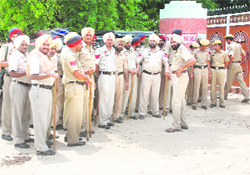 Policemen deployed in large strength at Gobindpura village of Mansa district on Wednesday to prevent any untoward incident.