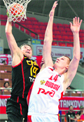 Russia's Alexey Kurtsevich (R) and China's Xi Re Li Jiang vie for the ball during their FIBA Stankovic Continental Cup match in China on Thursday. Russia beat China 50-49