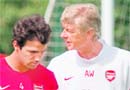 Arsenal�s Cesc Fabregas (L) with team manager Arsene Wenger 