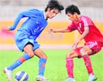 India�s Myron Mendes (L) and Maldive�s Ahusan Ibrahim tussle for the ball during their SAFF u-16 match in Kathmandu 